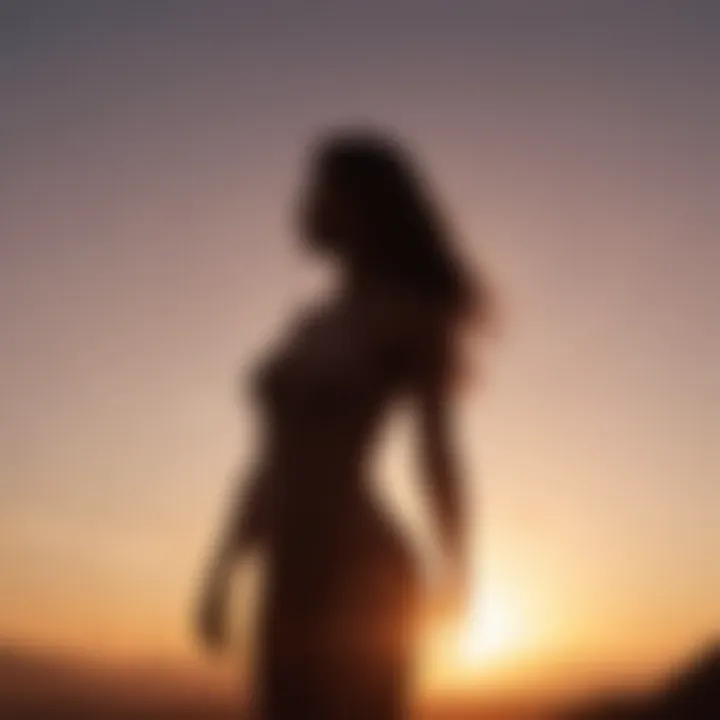 A silhouette of a woman standing tall against a sunrise, representing empowerment