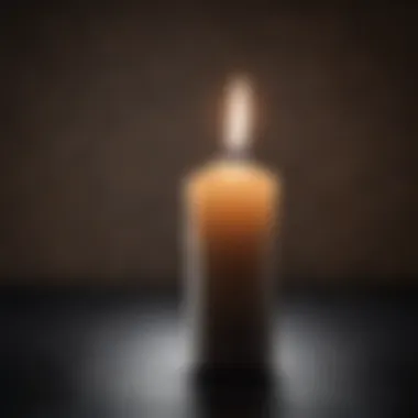 A close-up of a lit candle representing resilience in tough times