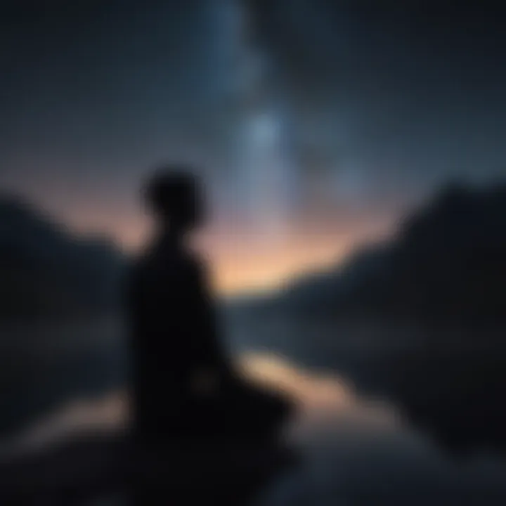 A silhouette of a person meditating against a backdrop of a starry night sky.