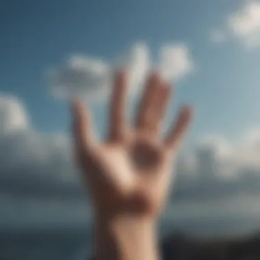 An open hand reaching towards the sky